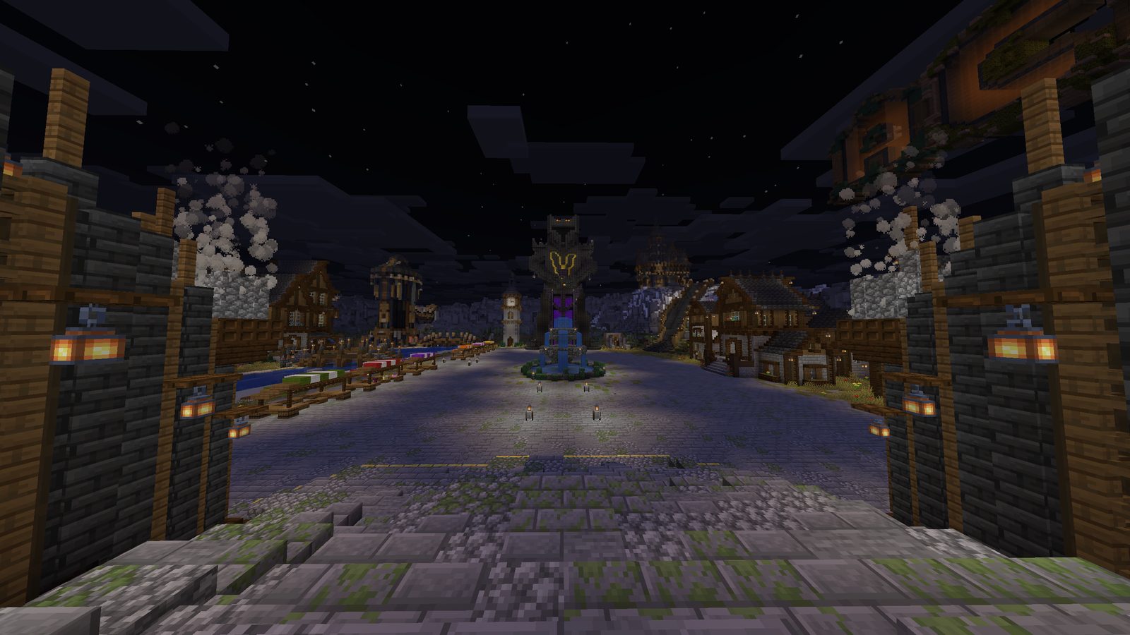 The AceV lobby at night: a paved square lit by lanterns, wood and stone houses and, in the middle, a tower with the AceV emblem above a fountain